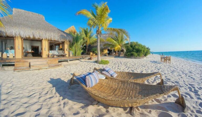 Luxury beachfront villa at Azura Benguerra overlooking white sand and turquoise ocean on Benguerra Island, Mozambique.