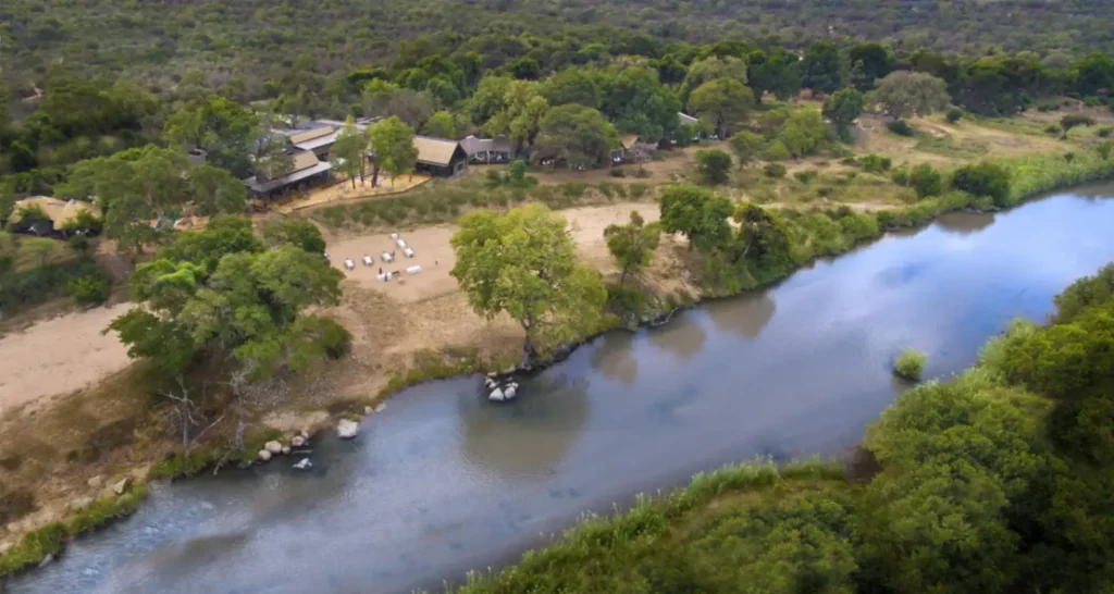 Aerial view of Lion Sands River Lodge and surrounding Kruger private reserve on a family safari