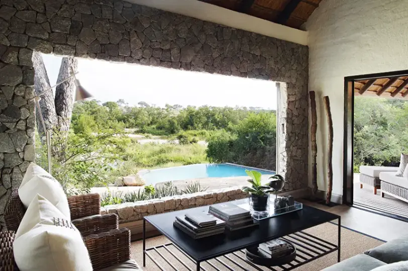 Upper-level bedroom and lounge at Londolozi Private Granite Suites with luxurious safari décor