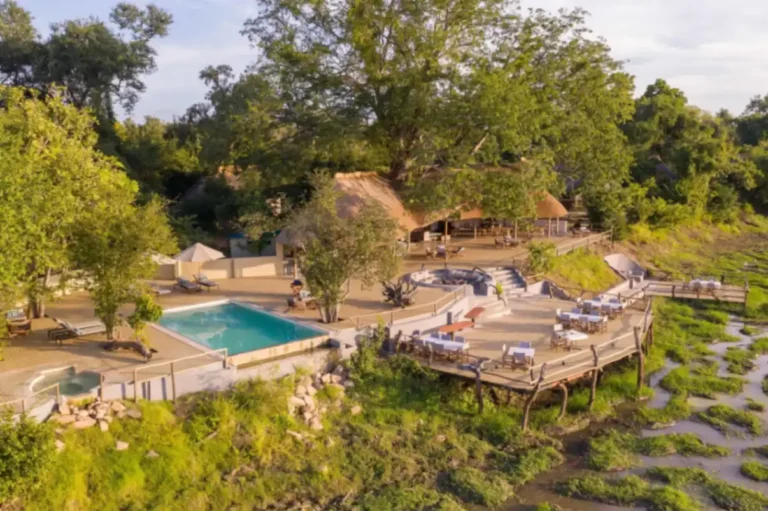 Front view of Kafunta Lodge in South Luangwa National Park, Zambia, surrounded by lush African wilderness