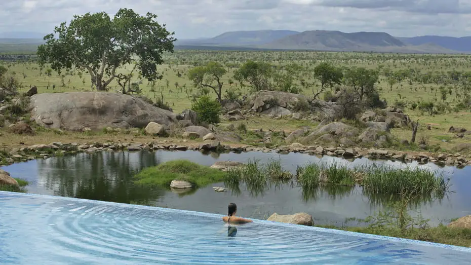 Infinity pool overlooking a wildlife waterhole at Four Seasons Safari Lodge Serengeti