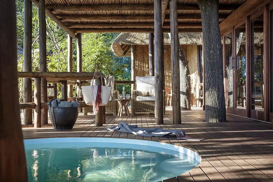 Luxury suite with a private plunge pool at Sanctuary Chief's Camp overlooking the floodplains of Botswana's Okavango Delta.